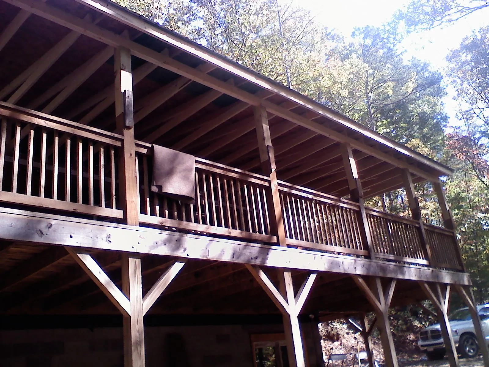 Timber framing under a new elevated porch and deck — Roof Leak Repair in North Sandwich by Roofing Brothers